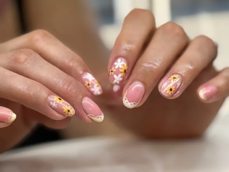 Soft French tips with hand-painted flowers