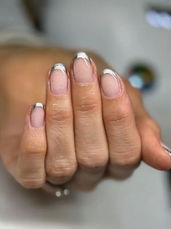 Silver-line French tips on a short natural shape