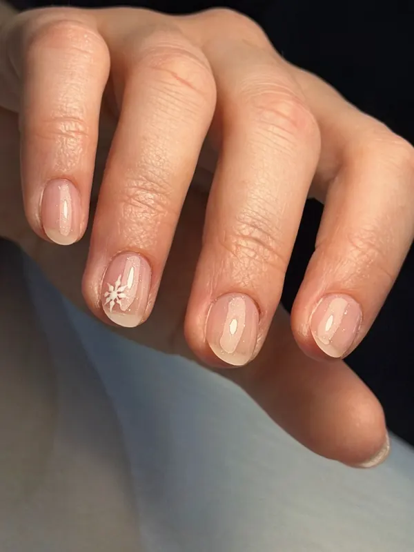 Sheer nude gel with a snowflake accent