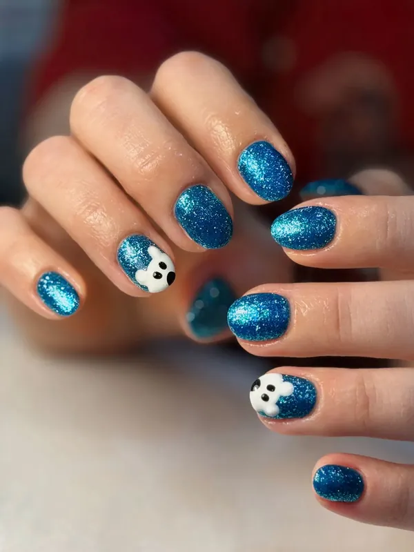Blue glitter gel with ghost nail art