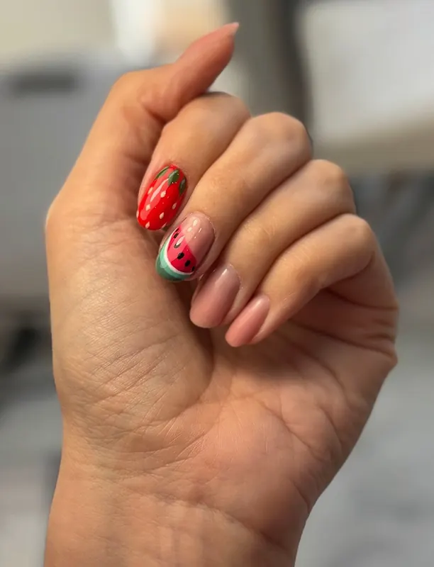 Strawberry and watermelon accent nails on soft nude